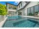 Luxury outdoor pool with modern architecture, seamless water design, and beautiful waterfront views at 7949 2Nd S Ave, St Petersburg, FL 33707