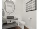 This powder room is complete with modern fixtures and finishes at 7949 2Nd S Ave, St Petersburg, FL 33707