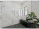 A glass enclosed shower is finished with beautiful tile at 7949 2Nd S Ave, St Petersburg, FL 33707