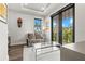 This sitting room is bright and airy and has balcony access at 7949 2Nd S Ave, St Petersburg, FL 33707