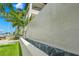 Modern water feature design complements waterfront living with lush greenery in the background at 7949 2Nd S Ave, St Petersburg, FL 33707