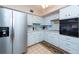 Efficient kitchen with stainless steel appliances and white cabinets at 2331 Finlandia Ln # 27, Clearwater, FL 33763