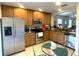 Kitchen with stainless steel appliances and wood cabinets at 18833 Bent Pine Dr, Hudson, FL 34667