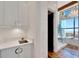 Modern bathroom with white cabinets, quartz countertops and a large shower at 226 5Th N Ave # 1406, St Petersburg, FL 33701