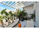 Spacious balcony with pergola, lounge chairs, and tropical plants at 226 5Th N Ave # 1406, St Petersburg, FL 33701