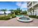 Inviting pool and spa area with brick pavers at 17745 Gulf Blvd # 604, Redington Shores, FL 33708