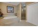 Spa-like bathroom with soaking tub and shower at 17745 Gulf Blvd # 604, Redington Shores, FL 33708