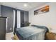 Bedroom with a queen-size bed and neutral decor at 14929 Promenade Pkwy, Odessa, FL 33556