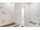 Entryway with stairs, powder room and door to the garage at 14929 Promenade Pkwy, Odessa, FL 33556