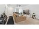 Bright living room with sectional sofa, and view into the kitchen area at 14929 Promenade Pkwy, Odessa, FL 33556