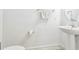 Clean and modern bathroom with pedestal sink and toilet at 14929 Promenade Pkwy, Odessa, FL 33556