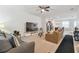 Open living room featuring a neutral color palette and ample natural light at 14929 Promenade Pkwy, Odessa, FL 33556