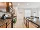 Modern kitchen with granite countertops and stainless steel appliances at 14929 Promenade Pkwy, Odessa, FL 33556