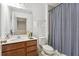Clean bathroom with a shower/tub combo and wood vanity at 14929 Promenade Pkwy, Odessa, FL 33556