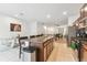 Open kitchen with island, stainless steel appliances, and granite countertops at 14929 Promenade Pkwy, Odessa, FL 33556