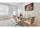 Bright dining room featuring a glass table and modern chairs at 14929 Promenade Pkwy, Odessa, FL 33556