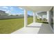 Covered patio overlooking a spacious grassy backyard at 10341 Fieldstone Myrtle Way, San Antonio, FL 33576