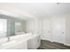 Modern bathroom with double vanity and a large mirror at 10341 Fieldstone Myrtle Way, San Antonio, FL 33576
