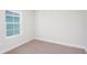Spacious bedroom with neutral carpeting and window at 10341 Fieldstone Myrtle Way, San Antonio, FL 33576