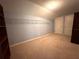 Spacious bedroom with carpet floors, closet with metal shelving, and two doors at 10411 Riverburn Dr, Tampa, FL 33647