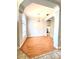 Bright dining room features wood floors, chair railing, natural light, chandelier and arched entrance at 10411 Riverburn Dr, Tampa, FL 33647