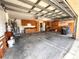 Spacious garage with wooden cabinets for storage and a lot of extra space at 10411 Riverburn Dr, Tampa, FL 33647
