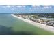 Aerial view of beachfront homes and condos with ocean views at 19718 Gulf Blvd, Indian Shores, FL 33785