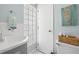 Small bathroom with gray vanity, wicker basket, and seahorse art at 19718 Gulf Blvd, Indian Shores, FL 33785