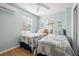 Bedroom with two twin beds and beach-themed decor at 19718 Gulf Blvd, Indian Shores, FL 33785