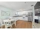 Charming kitchen with white cabinets, granite counters, and stainless steel appliances at 19718 Gulf Blvd, Indian Shores, FL 33785