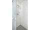 Shower with white tiles and patterned floor at 19718 Gulf Blvd, Indian Shores, FL 33785