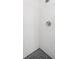 Clean shower with white subway tile walls and penny round floor tile at 19718 Gulf Blvd, Indian Shores, FL 33785
