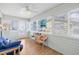 Bright sunroom with comfy seating, offering beach views at 19718 Gulf Blvd, Indian Shores, FL 33785