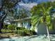 Side view of a single-story home with a palm tree and decorative driveway at 2132 Hailstone Cir # 378, Sun City Center, FL 33573