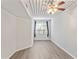 Bright bedroom with wood-look floors, ceiling fan, and large window at 2411 W Horatio St # 522, Tampa, FL 33609