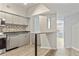 Modern kitchen with stainless steel appliances and light wood flooring at 2411 W Horatio St # 522, Tampa, FL 33609