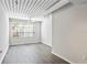 Bright bedroom with wood-look flooring and large window at 2411 W Horatio St # 522, Tampa, FL 33609