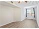 Well-lit bedroom, featuring wood-look floors and a large window at 2411 W Horatio St # 522, Tampa, FL 33609