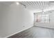 Bright bedroom with wood-look flooring and large window at 2411 W Horatio St # 522, Tampa, FL 33609