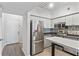 Modern kitchen with stainless steel appliances and light wood flooring at 2411 W Horatio St # 522, Tampa, FL 33609