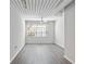 Spacious bedroom with wood-look flooring and large window at 2411 W Horatio St # 522, Tampa, FL 33609