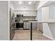 Modern kitchen with stainless steel appliances and light wood flooring at 2411 W Horatio St # 522, Tampa, FL 33609
