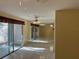 Bright dining room with tiled floor and mirrored wall at 1070 Seville Dr, Palm Harbor, FL 34684