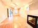 Living room with hardwood floors, fireplace, and pool view at 10411 Riverburn Dr, Tampa, FL 33647