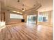 Open living room with a fireplace and sliding doors to pool area at 10411 Riverburn Dr, Tampa, FL 33647