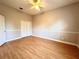 Large bedroom with light wood flooring and a double-door closet at 10411 Riverburn Dr, Tampa, FL 33647