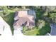 Two-story house with pool and attached garage, aerial view at 10411 Riverburn Dr, Tampa, FL 33647