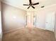 Bright bedroom with carpet flooring and ceiling fan at 10411 Riverburn Dr, Tampa, FL 33647