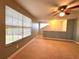 Spacious bedroom with window, ceiling fan and neutral decor at 10411 Riverburn Dr, Tampa, FL 33647