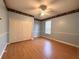 Bright bedroom with light wood flooring and double door closet at 10411 Riverburn Dr, Tampa, FL 33647